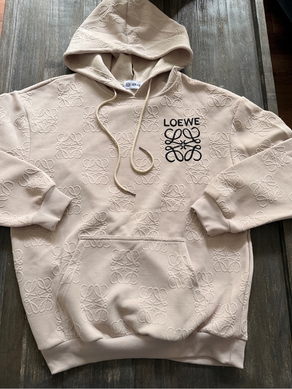 Loewe Men's Embossed Anagram Hoodie in Light Beige with Black Logo